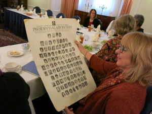 Deborah Ashford holds a poster of Carter Administration female appointees.