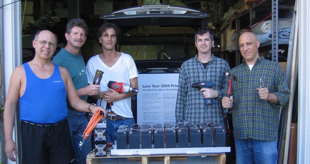 CalCars volunteers work on the first Prius conversion to a plug-in hybrid. From left: Felix Kramer; Marc Geller; Kevin Lyons, and Andrew Lawton. (Photo courtesy of CalCars.)